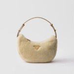 Prada Arqué shearling and leather shoulder bag